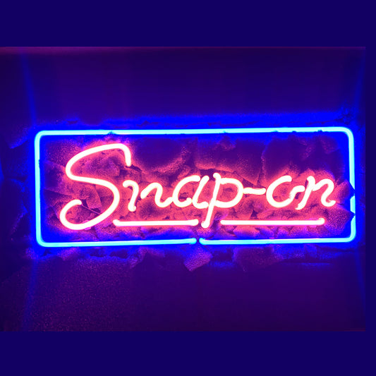 Neon sign of snap-on wording, underline on botton and square shapes surround the whole font, tools logo